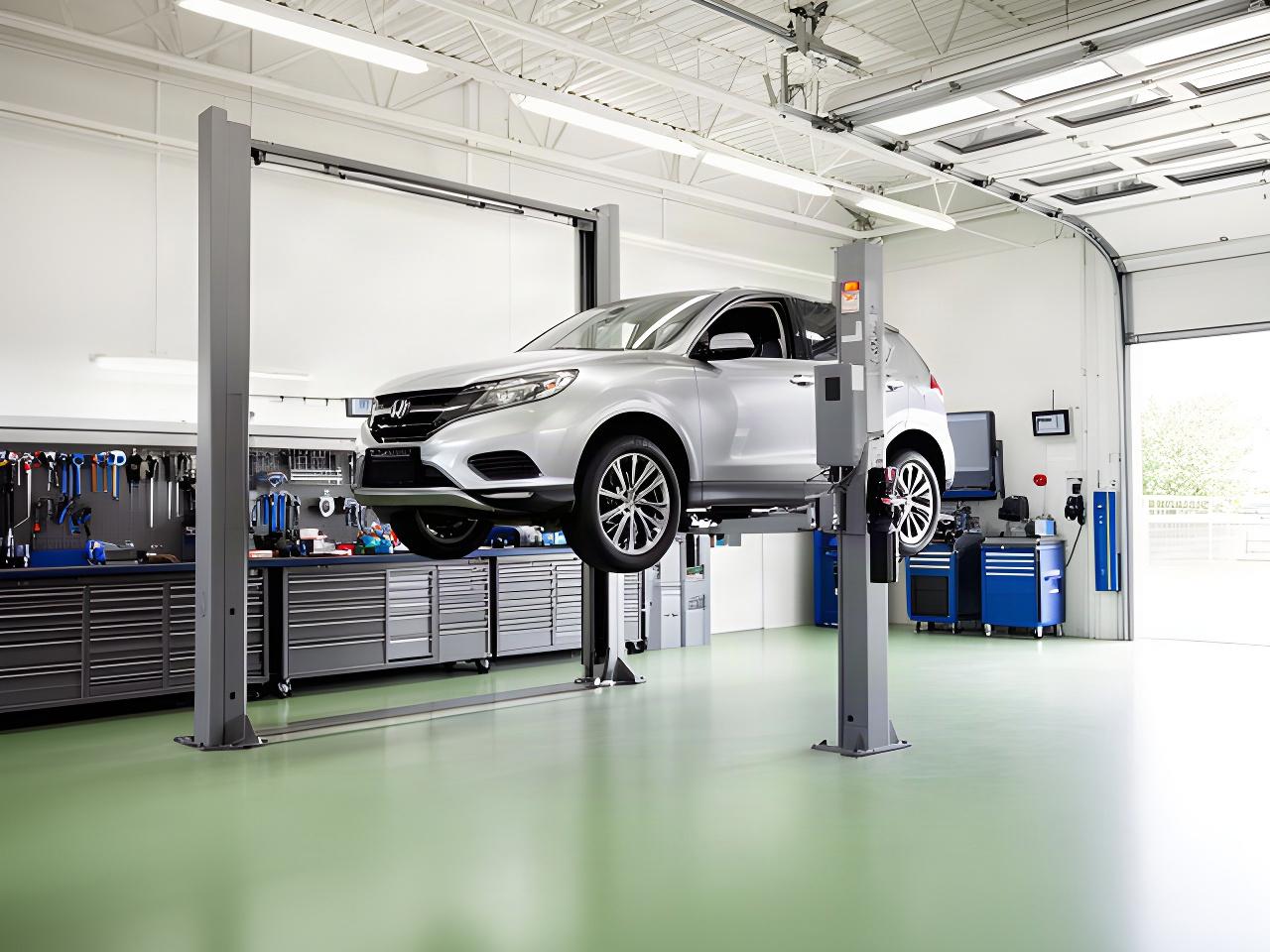 Clean automotive service bay with a vehicle raised for careful inspection and repair